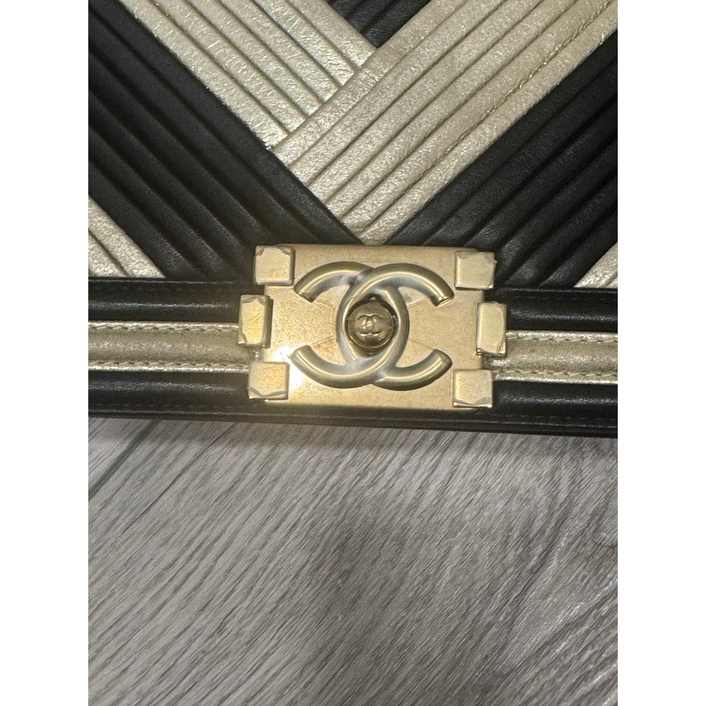 Chanel chevron gold and black shoulder boy bag