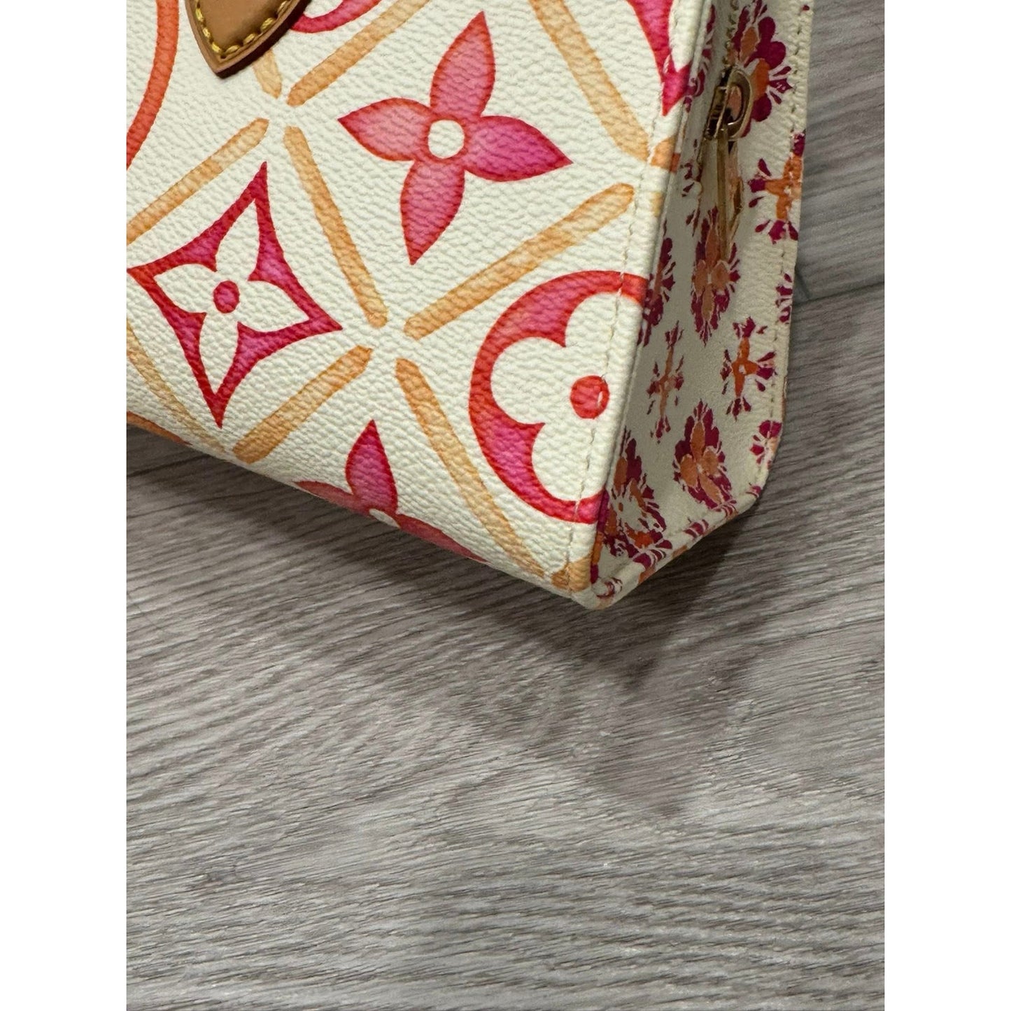 Lv On the go east west by the pool orange and pink
