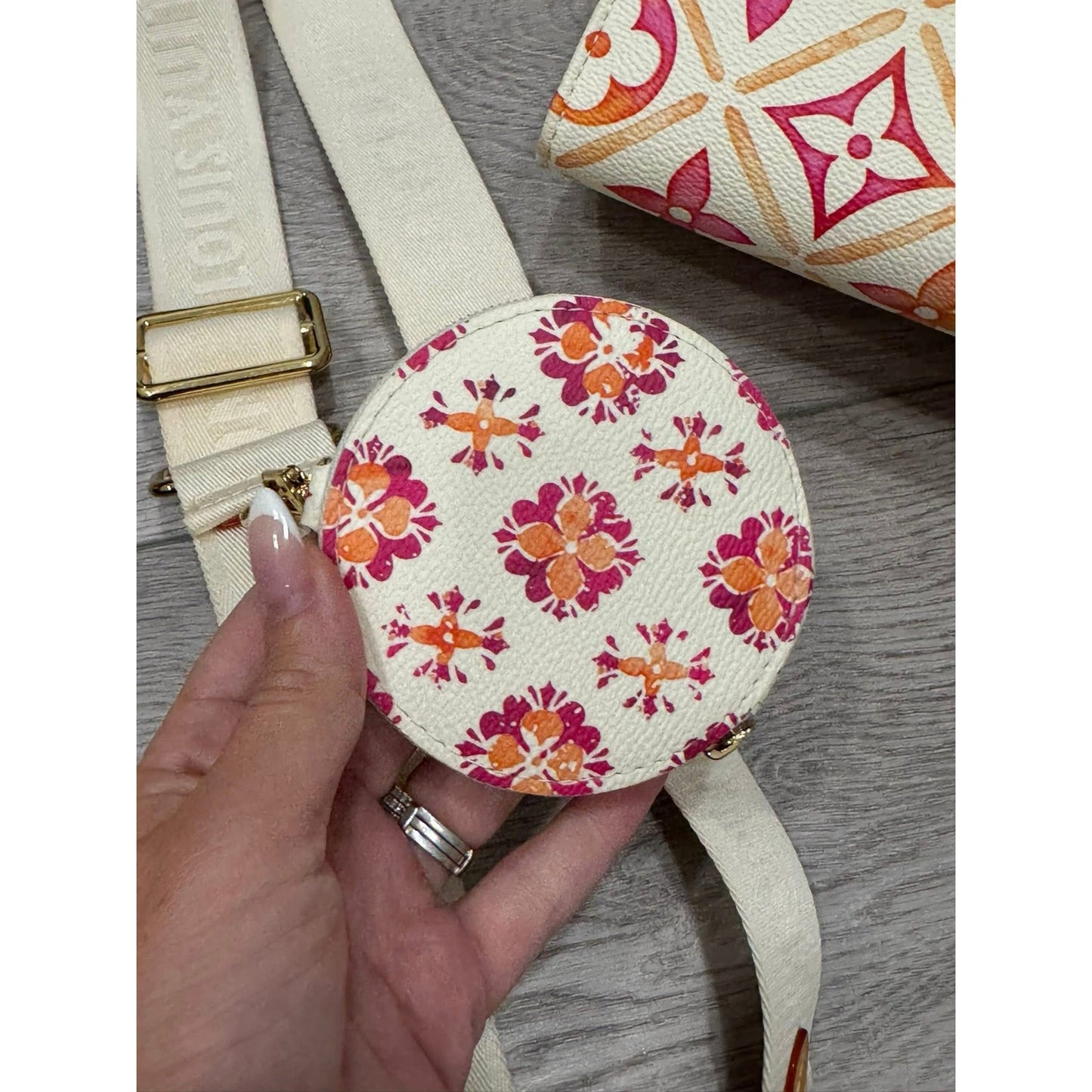 Lv On the go east west by the pool orange and pink