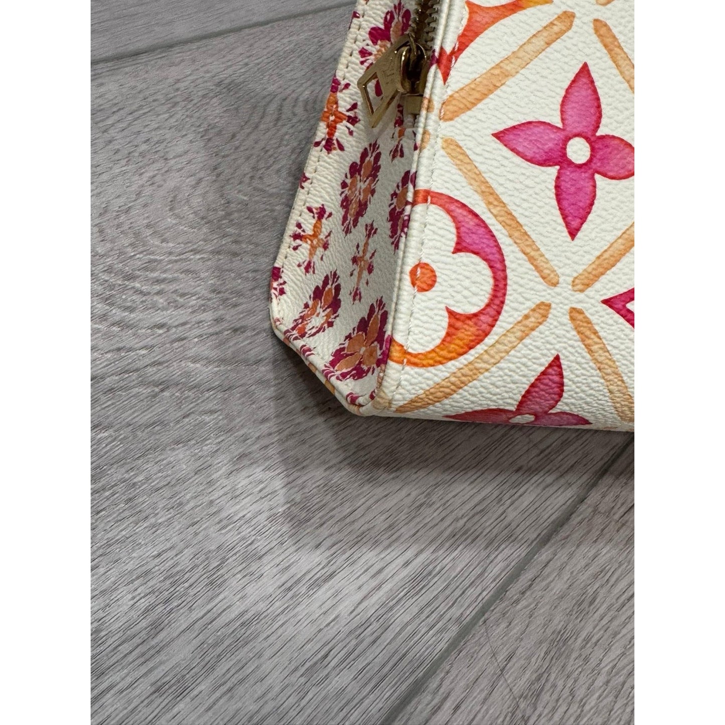 Lv On the go east west by the pool orange and pink