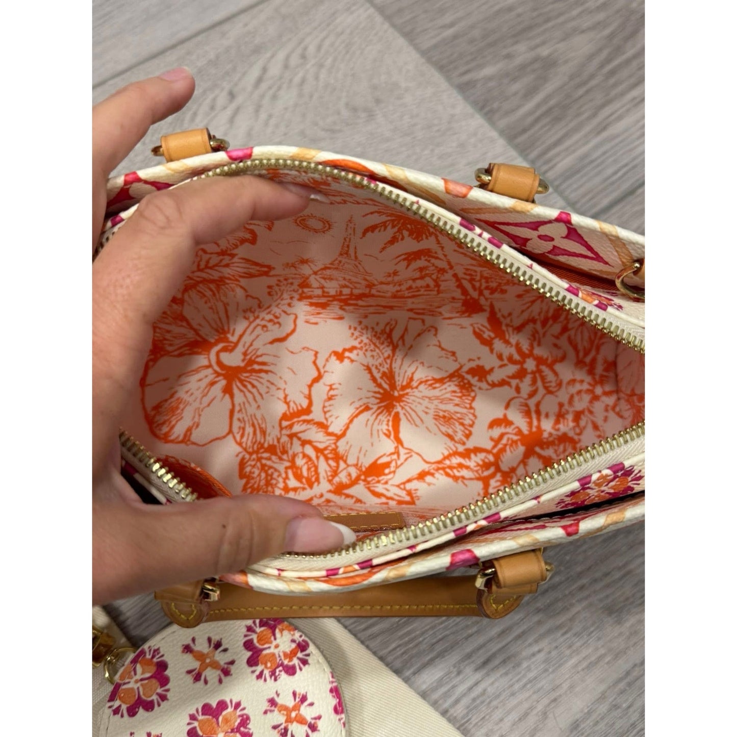 Lv On the go east west by the pool orange and pink